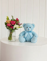 The Wild flower The Cuddle Petite gift set with a vibrant wildflower bouquet in a mason jar and a blue plush teddy bear