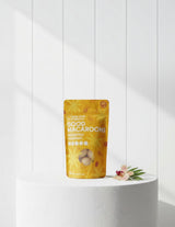 The Wild flower Little Bird Organics Passionfruit and Macadamia organic vegan coconut macaroons in a yellow snack pouch.