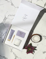 The Wild flower Pamper Gift Box featuring a body bar, hand cream, and soy candle in a white magnetic presentation box.