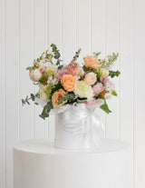 The Wild flower Luxury Pastel Perfection bouquet of mixed pastel roses and greenery in a white hat box with ribbon.