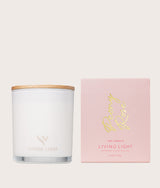 The Wild flower Living Light Peony Rose scented candle in a glass jar with a wooden lid and matching pink gift box.