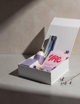 The Wild flower Treat Her wellness gift box featuring Living Light skincare, YAE face mask, and Kāko artisan chocolate.